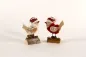 Preview: Weihnachtsvogel auf Baumstamm in rot – charmante Dekofigur aus Holz