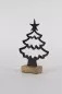 Preview: Weihnachtsbaum aus schwarzem Metall auf Holzsockel – moderne Deko für Ihr Zuhause