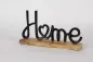 Preview: Schriftzug Home Metall schwarz auf Regal dekoriert