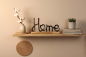 Preview: Schriftzug Home Metall schwarz auf Regal dekoriert