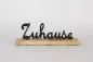 Preview: Schriftzug Zuhause aus schwarzem Metall als Wanddeko