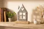Preview: Haus aus Metall auf Mangoholz-Sockel – Zeitlose Tischdeko