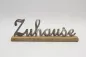 Preview: Freistehender Schriftzug Zuhause aus silbernem Metall auf Rega