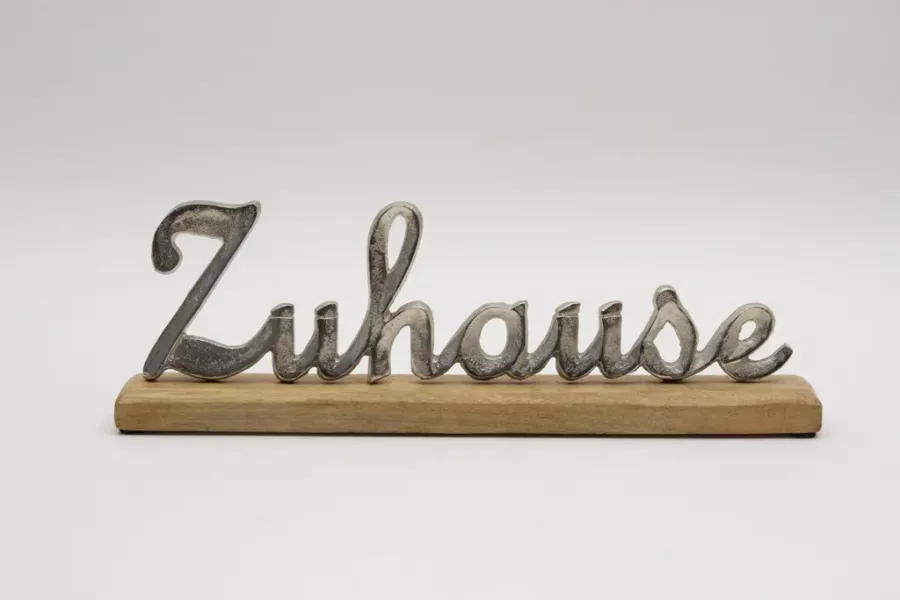 Preview: Freistehender Schriftzug Zuhause aus silbernem Metall auf Rega
