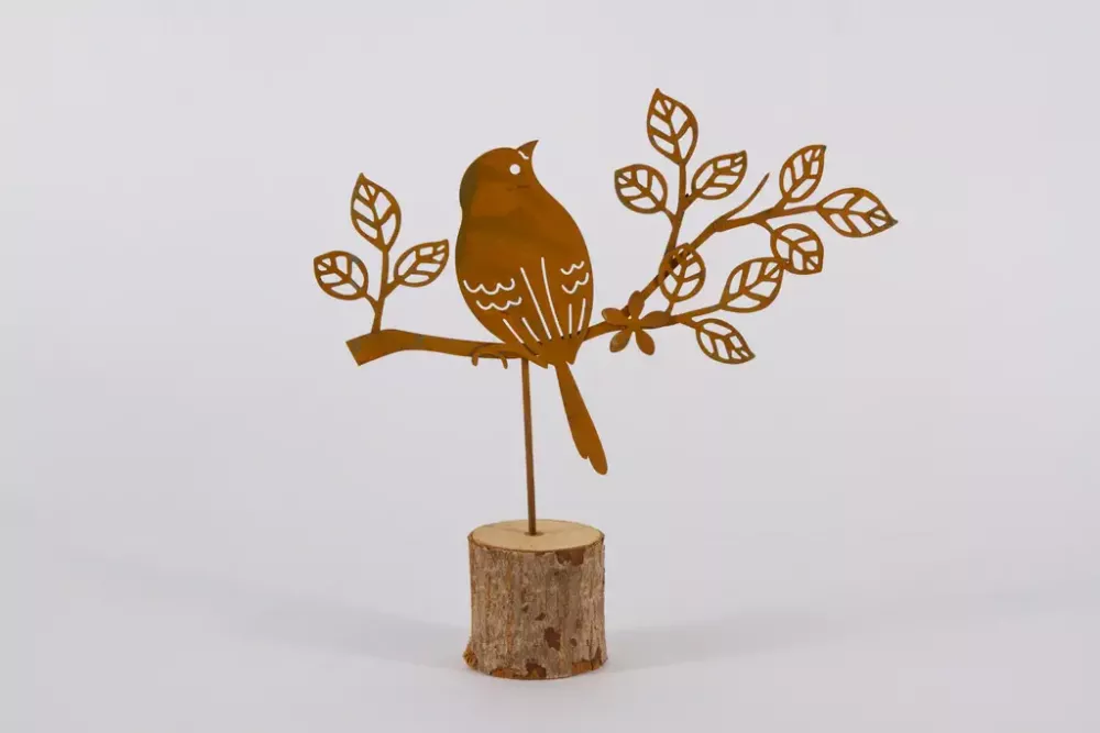 Vogel auf Holzstamm Edelrost stehend